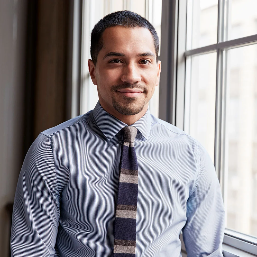 young hispanic business man smiling to camera pgjv4ck